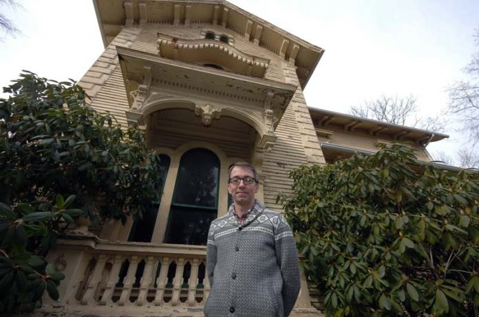 LIVING HISTORY: Jerry Eklund at his West Warwick home, better known at The William B. Spencer House. The structure was recently placed on the National Register of Historic Places. / PBN PHOTO/BRIAN MCDONALD