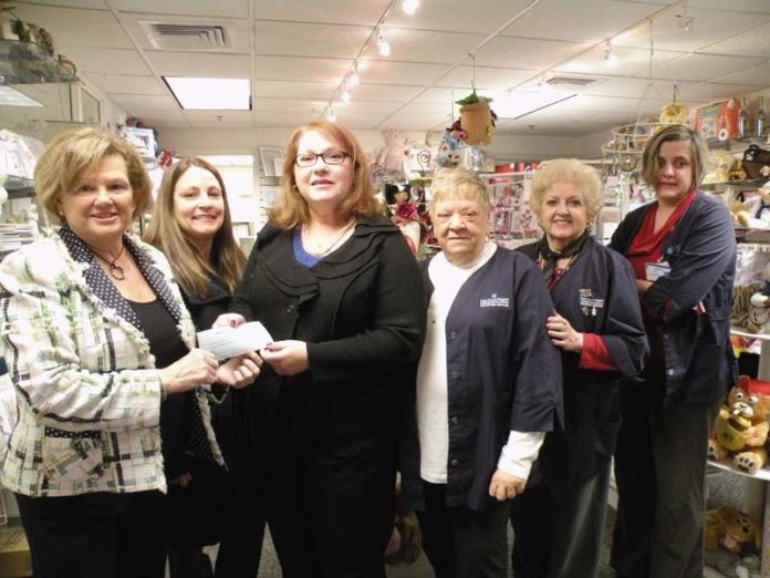 RITA CAPOTOSTO, third from left, senior program director at St. Vincent’s, receives a $2,500 donation from Friends of St. Anne’s volunteers. Remaining, from left: Janis Karam, Lisa Van Regenmorter, Terry Costa, Rita Tetrault and Valerie Griego.