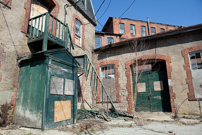 RESTORING RESPECT: The 150-year-old Pontiac Mills in Warwick was once pegged for a $52 million restoration project. That fell through, and prospective buyers are apprehensive without a historic-tax-credit program in place. / PBN PHOTO/RUPERT WHITELEY