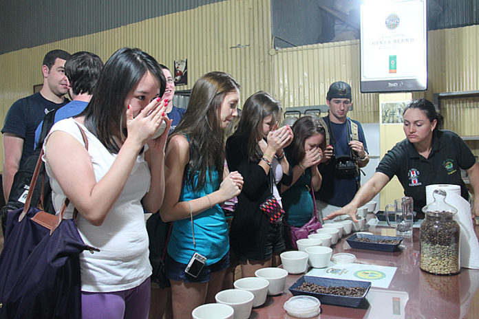 TASTER'S CHOICE: For a class, Bryant 
students traveled to Costa Rica. Here they rate coffee. / COURTESY BRYANT UNIVERSITY