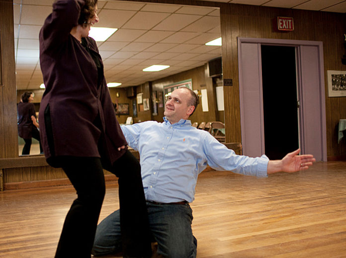 BRINGING IT HOME: Keith Lavimodiere of The Washington Trust Co. practices with dance instructor Deb O’Donnell. He’s one of seven “celebrity” dancers in an April 26 fundraiser for the Rhode Island Mentoring Partnership. / PBN FILE PHOTO/DAVID LEVESQUE