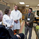 DEVELOPING SKILLS: Rep. James R. Langevin at URI with students and faculty, from left: Anna Deleon, Stephanie Hernandes, Stephanie Piantedosi, Ben Javery and co-directors of biotechnology Greg Paquette and Denice Spero. / PBN PHOTO/CATIA CUEN