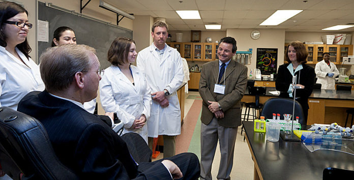 DEVELOPING SKILLS: Rep. James R. Langevin at URI with students and faculty, from left: Anna Deleon, Stephanie Hernandes, Stephanie Piantedosi, Ben Javery and co-directors of biotechnology Greg Paquette and Denice Spero. / PBN PHOTO/CATIA CUEN