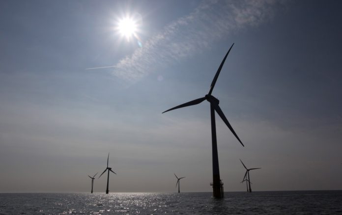 NSTAR agreed to buy power from the proposed Cape Wind offshore wind farm for more than double the cost of conventional sources, according to the Associated Press.  / BLOOMBERG FILE PHOTO/CHRIS RATCLIFFE