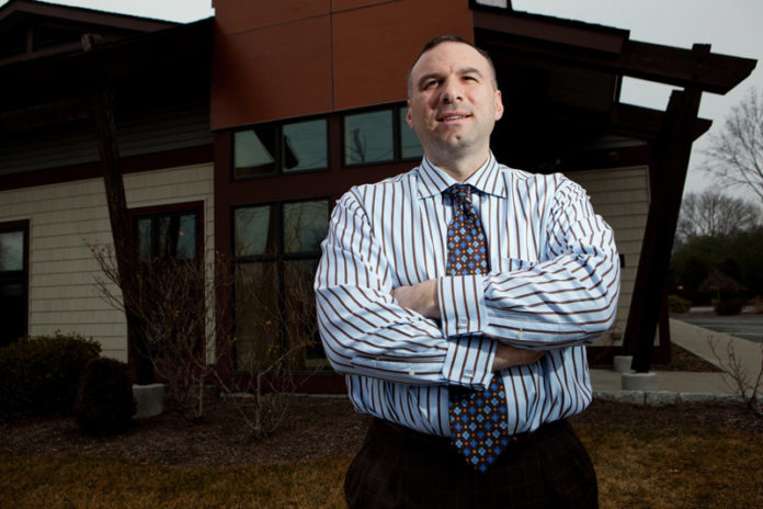 BUILDING SOMETHING: New England Construction Director of Finance Michael Alviano joined the company four years ago as an account manager. When the company lost its CFO soon after, Alviano assumed the responsibilities and, eventually, the position. / PBN PHOTO/RUPERT WHITELEY BUILDING SOMETHING: New England Construction Director of Finance Michael Alviano joined the company four years ago as an account manager. When the company lost its CFO soon after, Alviano assumed the responsibilities and, eventually, the position. / PBN PHOTO/RUPERT WHITELEY