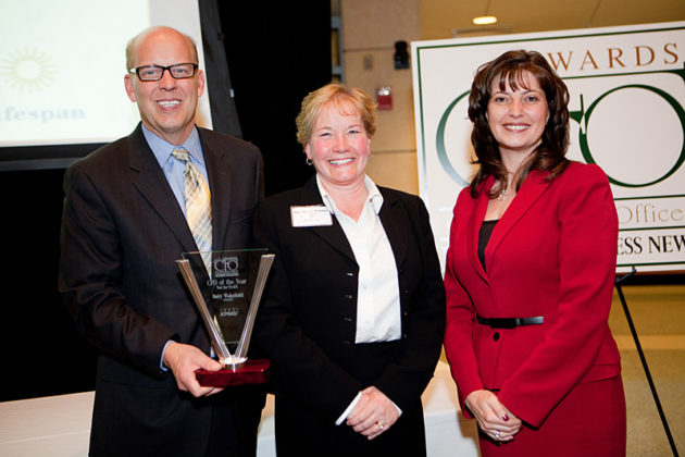 Honoree Mary Wakefield, Lifespan (center) with PBN Publisher Roger Bergenheim and Kristin Fraser, KPMG / Rupert Whiteley
