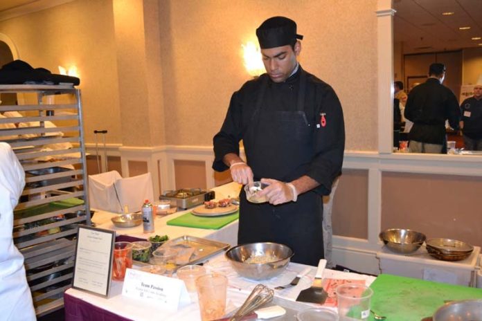 COURTESY EXETER JOB CORPS ACADEMY
JOB WELL-DONE: Rafael Alvarez, a student at Exeter Job Corps Academy and sous chef for Team Passion in the Rhode Island ProStart competition, prepares a dish for the contest at the Radisson Hotel Providence Airport in Warwick.
