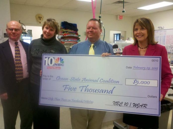 FROM LEFT: Gil Fletcher, treasurer of the Ocean State Animal Coalition; Pamela Knoecklein, clinical director at the Rhode Island Community Spay/Neuter Clinic; and Tom Gulluscio, president of the Ocean State Animal Coalition;  are presented with a $5,000 donation by WJAR-TV NBC 10 News Anchor Patrice Wood.