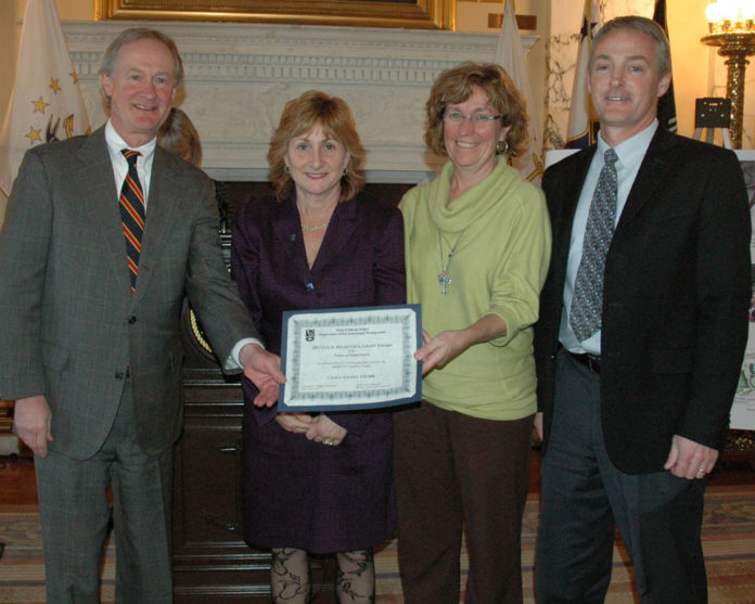 A PLAYGROUND in Jamestown landed $38,000 in funding from the R.I. Dept. of Environmental Management.  From left, Gov. Lincoln D. Chafee, R.I. Rep. Deborah Ruggiero, Lawn Avenue School Principal Kathy Almanzor and Clayton Carlisle of the kidsROCK fundraising committee. / COURTESY RHODE ISLAND STATE HOUSE