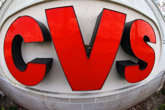 CVS CAREMARK reported an 8.8 percent rise in first quarter profits after grabbing customers from Walgreen Co. / BLOOMBERG FILE PHOTO/ELIOT J. SCHECHTER