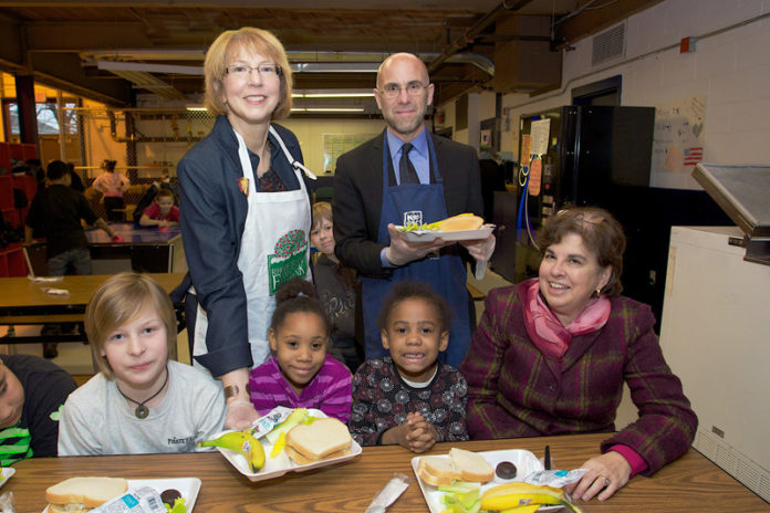 SANRDA J, PATTIE, rear left, president and CEO of BankNewport; Andrew Schiff, right, CEO of the Rhode Island Community Food Bank; and Joanne Hoops, seated, right, executive director of the Boys & Girls Clubs of Newport County, visited the Park Holm Boys & Girls Clubs in Newport.