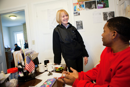HOUSE BECOMES A HOME: Eileen Hayes, president and CEO of Amos House, speaks with case manager Sonny Ramsey. She oversees a staff of 55. / PBN FILE PHOTO/RUPERT WHITELEY