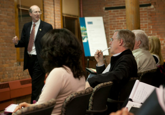 ENTREPRENEURS listen to George Simmons, of Derby Management Consultants in Boston, describe how to write a business plan at the Rhode Island Center for Innovation & Entrepreneurship. / PBN PHOTO/DAVID LEVESQUE