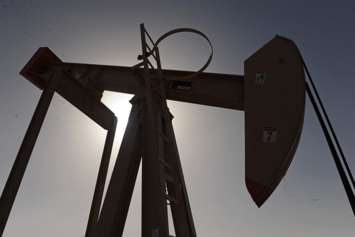 OIL PRICES DROPPED in New York amid European debt concern after a Greek poll.  / BLOOMBERG FILE PHOTO