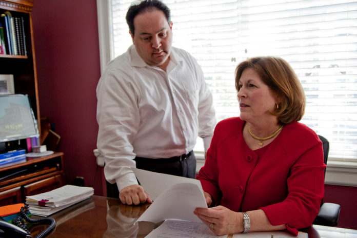 SIMPLE FORMULA: Miriam A. Ross has a simple formula for success: Work hard at what you love and stay focused. She’s pictured with Kevin P. Braga, of counsel for Ross’ law firm. / PBN FILE PHOTO/NATALJA KENT