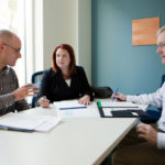 A SEAT AT THE BIG TABLE: Shanna Marzilli enjoys her role at the state&rsquo;s largest health insurer as it works to transform the process of health care delivery. With her are Jonathan Holway, left, a strategy analyst for Blue Cross & Blue Shield of Rhode Island, and Jeremy Duncan, an assistant vice president in the insurer&rsquo;s strategic-transformation office. / PBN PHOTO/RUPERT WHITELEY