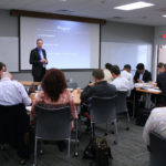 Brown tight-lipped on district plans COURTESY KARL DOMINEY
GAINING KNOWLEDGE: Brown Executive MBA professor Carl Kock leads a class in competitive strategy at the new Providence offices of Brown University Continuing
Education.