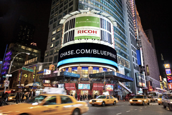 COURTESY COOLEY GROUP
GETTING THE MESSAGE: Cooley’s 6,000-square-foot billboard in New York City’s Times Square. The billboard uses thin solar panels, reducing costs and emissions.
