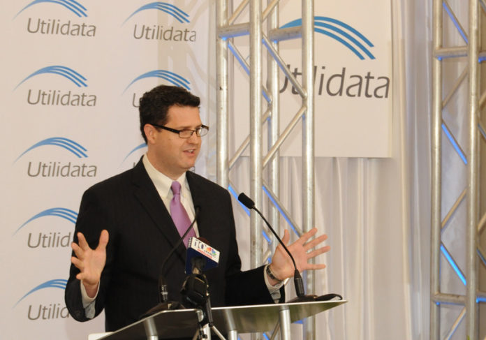 Scott DePasquale, executive chairman of Utilidata and a partner with Braemar Energy Ventures, speaks during the June 5 opening of the former’s Providence headquarters. The firm provides advanced automated energy-conservation and management technology services. It moved from Spokane, Wash., after receiving venture-capital financing from Braemar and a $500,000 loan from the Rhode Island Renewable Energy Fund. The firm has created eight jobs locally and expects a total of 47 high-paying, new jobs created by 2015. / PHOTO COURTESY UTILIDATA