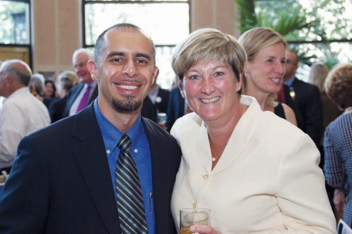 JORGE ELORZA, Roger Williams University law professor and Providence Housing Court judge, stands with with Linn Foster, partner at Nixon Peabody law firm, during Roger Williams’ annual Pro Bono Collaborative Cocktail Reception.