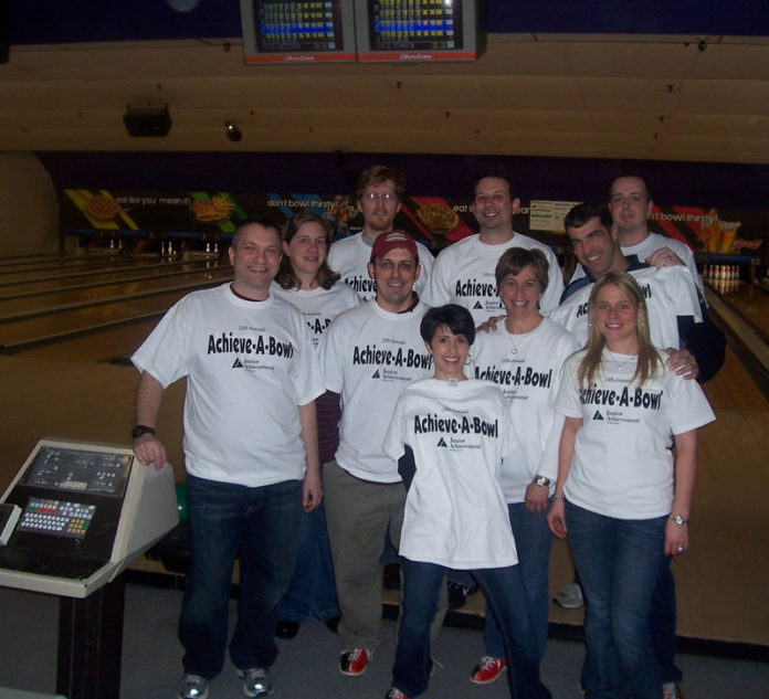 A STRIKE FOR COMMUNITY: Hinckley, Allen & Snyder staff participated in Junior Achievement’s Achieve-A-Bowl to raise money for its programs. / Courtesy HincKley, Allen & Snyder