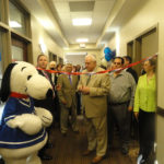 NEW BEGINNINGS: Barnum Financial employees celebrate the ribbon-cutting for the company's new Rhode Island facility this year. / COURTESY BARNUM FINANCIAL