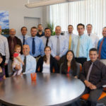 Regular, informal events help keep firm connected SOCIALLY SPEAKING: Turino Group President David Giardino, holding his daughter Sienna, funds pizza, wings and beer gatherings every Friday as a way to help the team communicate and stay close to one another. / Courtesy Turino Group
