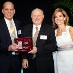 Karl Kozak, Pawtucket Credit Union, (center) with Roger Bergenheim and Nancy Adeszko, PBN / Rupert Whiteley