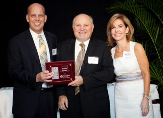 Karl Kozak, Pawtucket Credit Union, (center) with Roger Bergenheim and Nancy Adeszko, PBN / Rupert Whiteley
