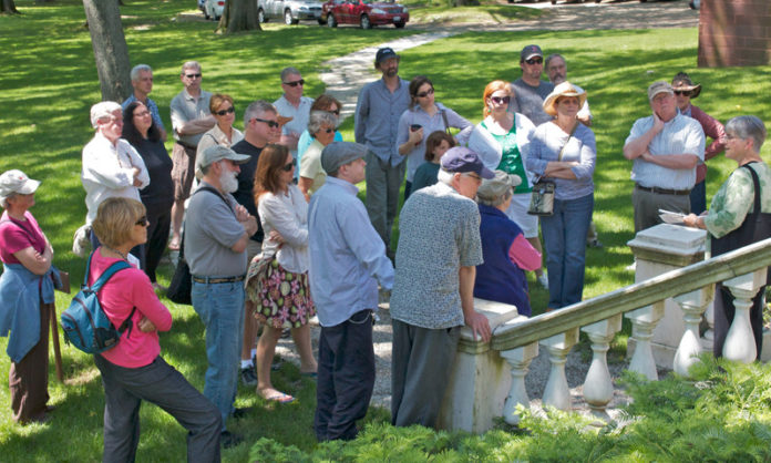 COURTESY STEWART MARTIN PHOTOGRAPHY
LIVING HISTORY: In the yard at the Rhode Island Historical Society’s John Brown House Museum, walkers listen to the tour guide’s introduction before a walking tour begins.