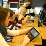 Tablets finding a home in R.I. classrooms COURTESY ROCKY HILL SCHOOL
A NEW APPROACH: Third- and eighth-graders at Rocky Hill joined up to use an iPad app that teaches children about making change. From left: Ava Lamoureux, Sara Laurent, Hannah Stowe, Cailee DeAngelis.