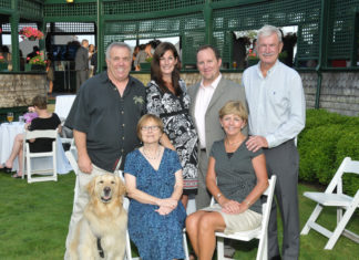 Winner Matt Dempsey, Site Specific (standing, second from right) surrounded by friends and family / Skorski Photography