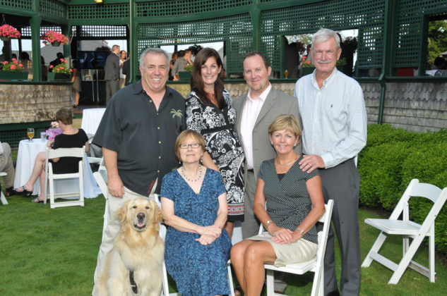 Winner Matt Dempsey, Site Specific (standing, second from right) surrounded by friends and family / Skorski Photography
