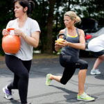 Company puts global experience to work here GETTING FIT: As part of Preventure’s Fit for Life program, employees Valeria Tivnan, left, and Kim Freeman take part in a crossfit workout sponsored by the company. / PBN PHOTO/
RUPERT WHITELEY
