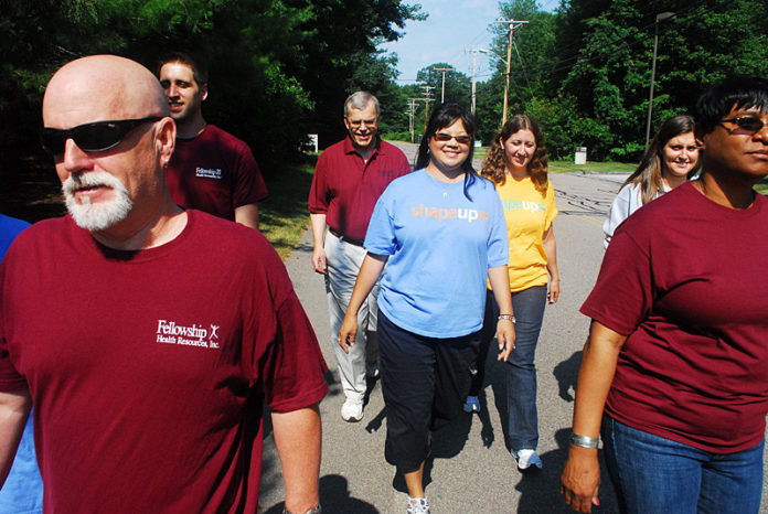 TEAMING UP FOR FITNESS: Staff at Fellowship Health Resources walked more than 43 million steps this past spring as part of a workplace wellness program that encouraged exercise and healthy eating. / PBN PHOTO/PAUL KANDARIAN