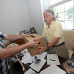 Great strides with new program FRESHLY FUELED: Moran Shipping has worked a deal with Farm Fresh Rhode Island to deliver fresh vegetables. Above, company wellness coordinator Mike Sullivan, left, hands off a box of vegetables to his father, Senior Vice President Tom Sullivan. / PBN PHOTO/BRIAN MCDONALD