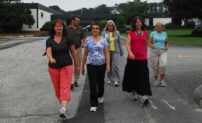 HITTIN’ THE ROAD: Rhode Island Medical Imaging employees often take to the pavement at lunch time thanks to a year-old push for employee wellness. / PBN PHOTO/PAUL KANDARIAN