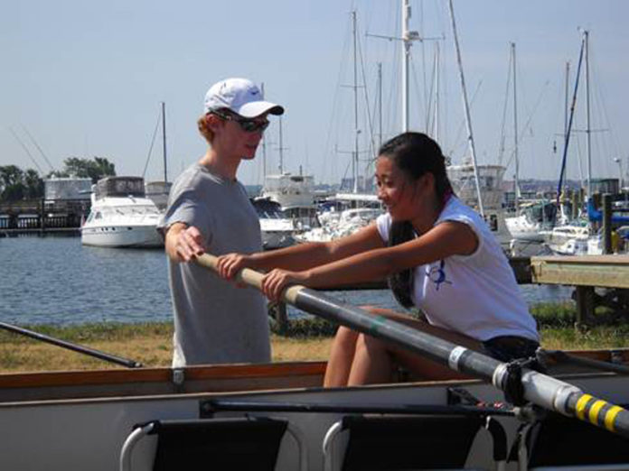 BAYCOAST BANK recently donated $2,000 in support of New Bedford Community Rowing’s summer youth clinics. Above, instructor Sam Barrington Jr. helps participant Rachel Gin with her rowing technique during a clinic.