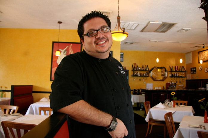 LOSS EATERS: Chris Palias, owner and head chef at Sophia's Tuscan Grille in Warwick, said that he is pleased with his Groupon experience. He estimates that he gained 15 regulars from the coupons. / PBN PHOTO/MICHAEL PERSSON