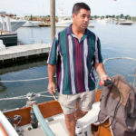 PUMPED UP: Ken Hilton, vice president of Standish Boat Yard, pumps out sewage for one of the slip's boats. / PBN PHOTO/NATALJA KENT