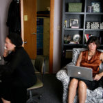 GIVING CARE: Social worker Anita Mink, left, and Elder at Home owner Carmen Roy check in on clients from their Pawtucket offices. / PBN PHOTO/MICHAEL PERSSON