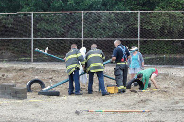 MORE THAN 30 community members, including local firefighters, helped install new play equipment at Smithfield’s Old County Road playground.