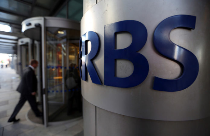 A VISITOR ENTERS the headquarters of the Royal Bank of Scotland Group Plc in London. RBS managers condoned and participated in the manipulation of global interest rates, indicating that wrongdoing extended beyond the four traders the bank has fired. / BLOOMBERG FILE PHOTO/CHRIS RATCLIFFE A VISITOR ENTERS the headquarters of the Royal Bank of Scotland Group Plc in London. RBS managers condoned and participated in the manipulation of global interest rates, indicating that wrongdoing extended beyond the four traders the bank has fired. / BLOOMBERG FILE PHOTO/CHRIS RATCLIFFE