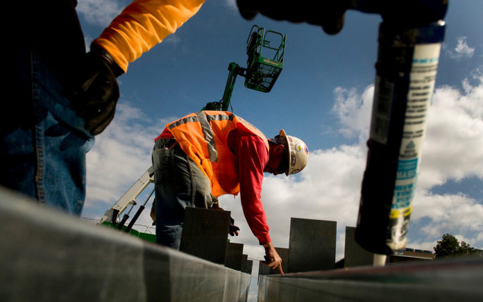 THE PROVIDENCE-FALL RIVER-WARWICK metro area saw construction jobs go from 20,300 to 20,800 in the 12 months ended Aug. 31, a gain of 2 percent.   / BLOOMBERG FILE PHOTO/SAM HODGSON