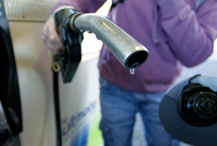 THE PRICE OF self-serve, unleaded regular gasoline fell 11 cents per gallon this week in Rhode Island and 10 cents in Massachusetts, to $3.78 and $3.67, respectively, according to AAA Southern New England.  / BLOOMERG FILE PHOTO/PAUL THOMAS