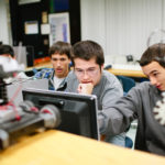 TECHNICAL SUPPORT: William M. Davies School robotics students, from left, Robert Feraria, Zachary Agruedo and Zachary Deschamps, are among the students benefiting from the Grainger donation. / PBN PHOTO/RUPERT WHITELY