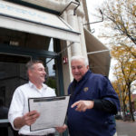 TAKE A BOW: Fred Goodwin, owner and general manager of Bravo Brasserie, left, speaks with former owner Peter J. Rotelli. The restaurant benefits from holiday-season performances at PPAC and Trinity. / PBN PHOTO/NATALJA KENT