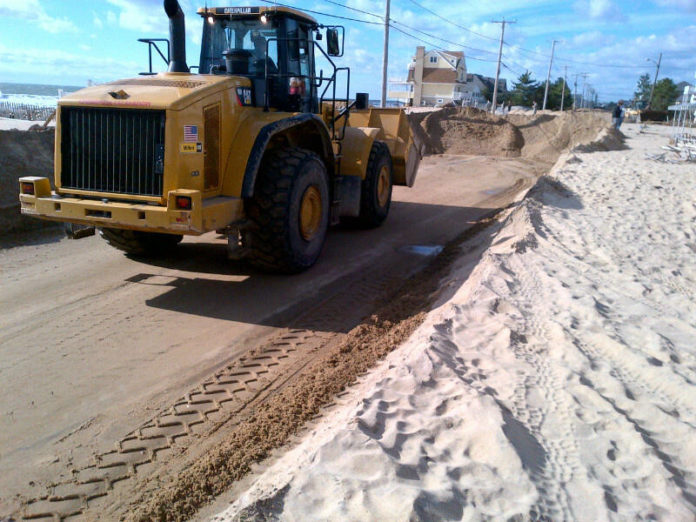 CREWS CLEAR SAND from Atlantic Avenue in Misquamicut on Nov. 1. / COURTESY THE OFFICE OF THE GOVERNOR