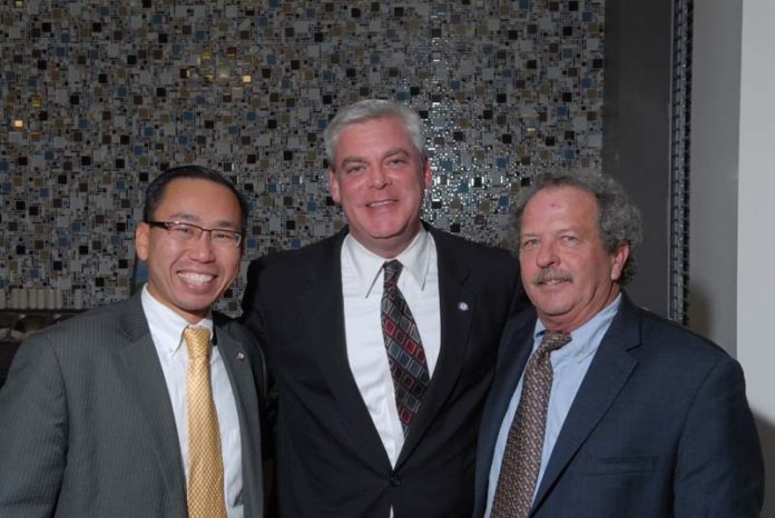 FROM LEFT: Cranston Mayor Allan Fung, Warwick Mayor Scott Avedisian and Mark Russell, Friends Way board member, recently attended a wine-tasting fundraiser for Friends Way.
