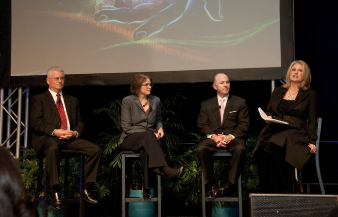 DURING THE 2012 ANNUAL MEETING of the Greater Providence Chamber of Commerce, the leaders of Rhode Island's three major life science institutions, from left, Dennis Keefe, president and CEO of Care New England, Christina H. Paxson, president of Brown University, and Dr. Timothy J. Babineau, president and CEO of Lifespan, spoke with Chamber President Laurie White about new ways the institutions will explore to collaborate on research. / COURTESY GREAT PROVIDENCE CHAMBER OF COMMERCE